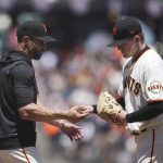 
              San Francisco Giants pitcher Logan Webb, right, hands the ball to manager Gabe Kapler as he is relieved during the sixth inning of a baseball game against the Colorado Rockies in San Francisco, Thursday, June 9, 2022. (AP Photo/Jeff Chiu)
            