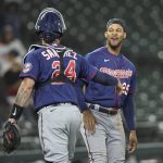 
              Minnesota Twins' Gary Sanchez (24) celebrates with Byron Buxton during a baseball game, Monday, June 13, 2022, in Seattle. Buxton hit a two-run home run and scored in the game. (AP Photo/John Froschauer)
            