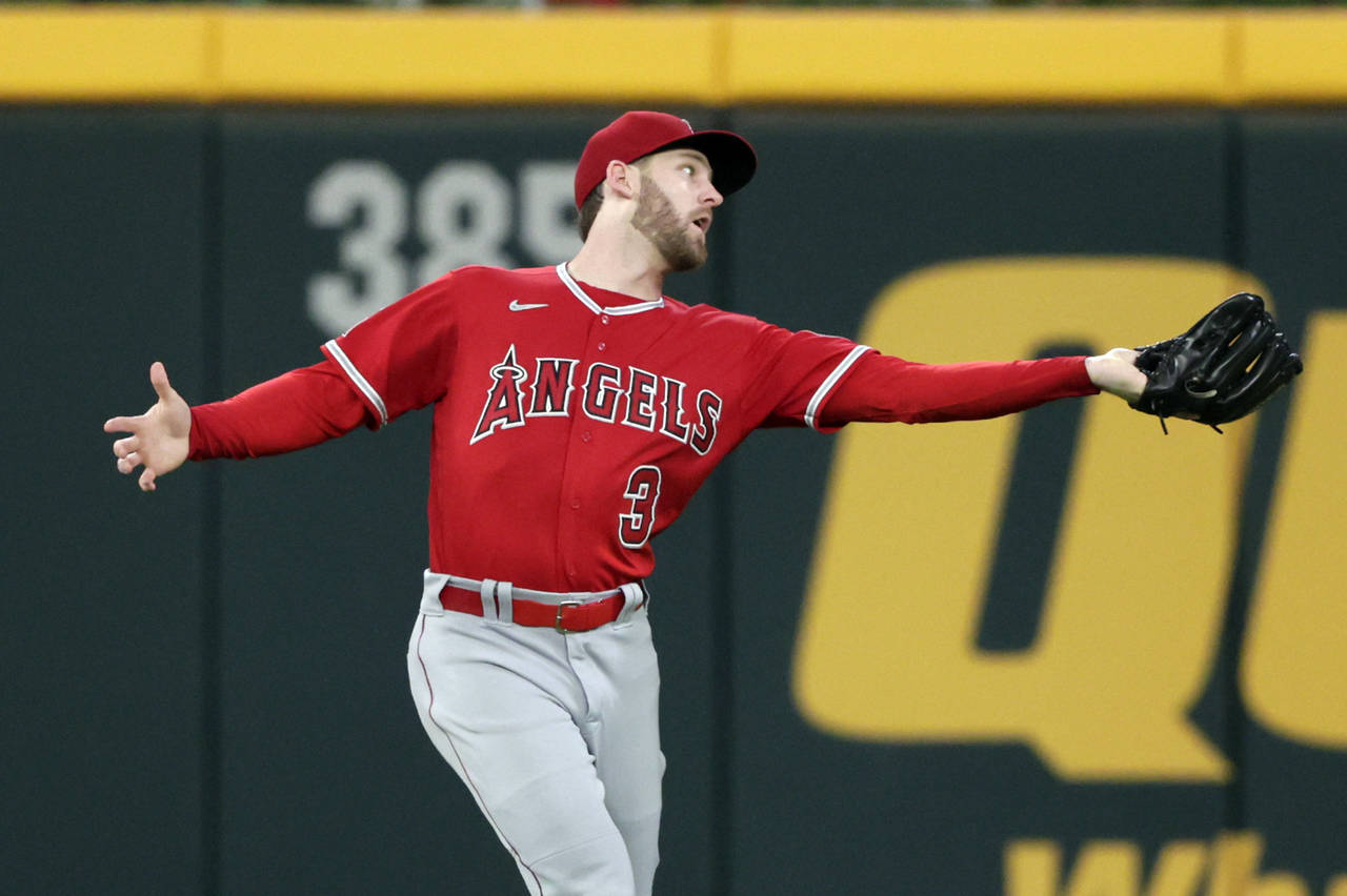 Los Angeles Angels right fielder Taylor Ward catches a fly ball for an out against Atlanta Braves' ...