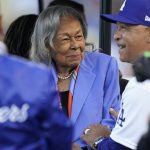 
              FILE - Los Angeles Dodgers' manager Dave Roberts, right, greets Rachel Robinson, wife of Jackie Robinson, before a baseball game between the Cincinnati Reds and the Los Angeles Dodgers in Los Angeles, Friday, April 15, 2022. Baseball's All-Stars gathered on the field before Tuesday night's, July 19, 2022,  game at Dodger Stadium to honor Rachel Robinson on her 100th birthday. (AP Photo/Ashley Landis, File)
            