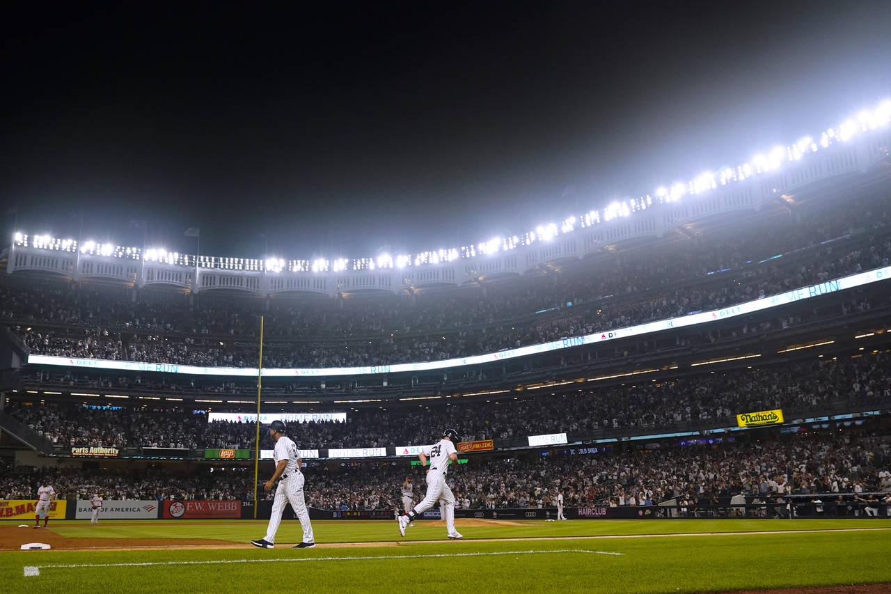 New York Yankees' Matt Carpenter (24) runs the bases after hitting a three-run home run against the...