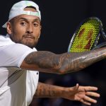 
              Australia's Nick Kyrgios returns to Serbia's Novak Djokovic during the final of the men's singles on day fourteen of the Wimbledon tennis championships in London, Sunday, July 10, 2022. (AP Photo/Kirsty Wigglesworth)
            