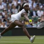 
              Coco Gauff of the US returns the ball to Amanda Anisimova of the US in a third round women's singles match on day six of the Wimbledon tennis championships in London, Saturday, July 2, 2022. (AP Photo/Alastair Grant)
            