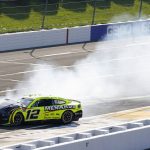 
              Smoke surrounds the car of Ryan Blaney (12) after an incident during a NASCAR Cup Series auto race at Pocono Raceway, Sunday, July 24, 2022, in Long Pond, Pa. (AP Photo/Matt Slocum)
            