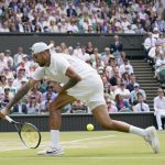
              Australia's Nick Kyrgios returns to Brandon Nakashima of the US in a men's singles fourth round match on day eight of the Wimbledon tennis championships in London, Monday, July 4, 2022. (AP Photo/Alberto Pezzali)
            