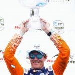 
              Scott Dixon, of New Zealand, lifts his trophy after winning an IndyCar auto race in Toronto, Sunday, July 17, 2022. (Andrew Lahodynskyj/The Canadian Press via AP)
            