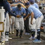 
              Tampa Bay Rays teammates greet Francisco Mejia, center, in the dugout after he hit a solo home run off Baltimore Orioles reliever Keegan Akin during the sixth inning of a baseball game Sunday, July 17, 2022, in St. Petersburg, Fla. (AP Photo/Steve Nesius)
            