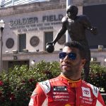 
              NASCAR driver Bubba Wallace poses for photos outside Soldier Field, near a statue of Walter Payton, on Tuesday, July 19, 2022, in Chicago during a promotional visit to announce a Cup Series street race in the city, to be held July 2, 2023. (AP Photo/Charles Rex Arbogast)
            