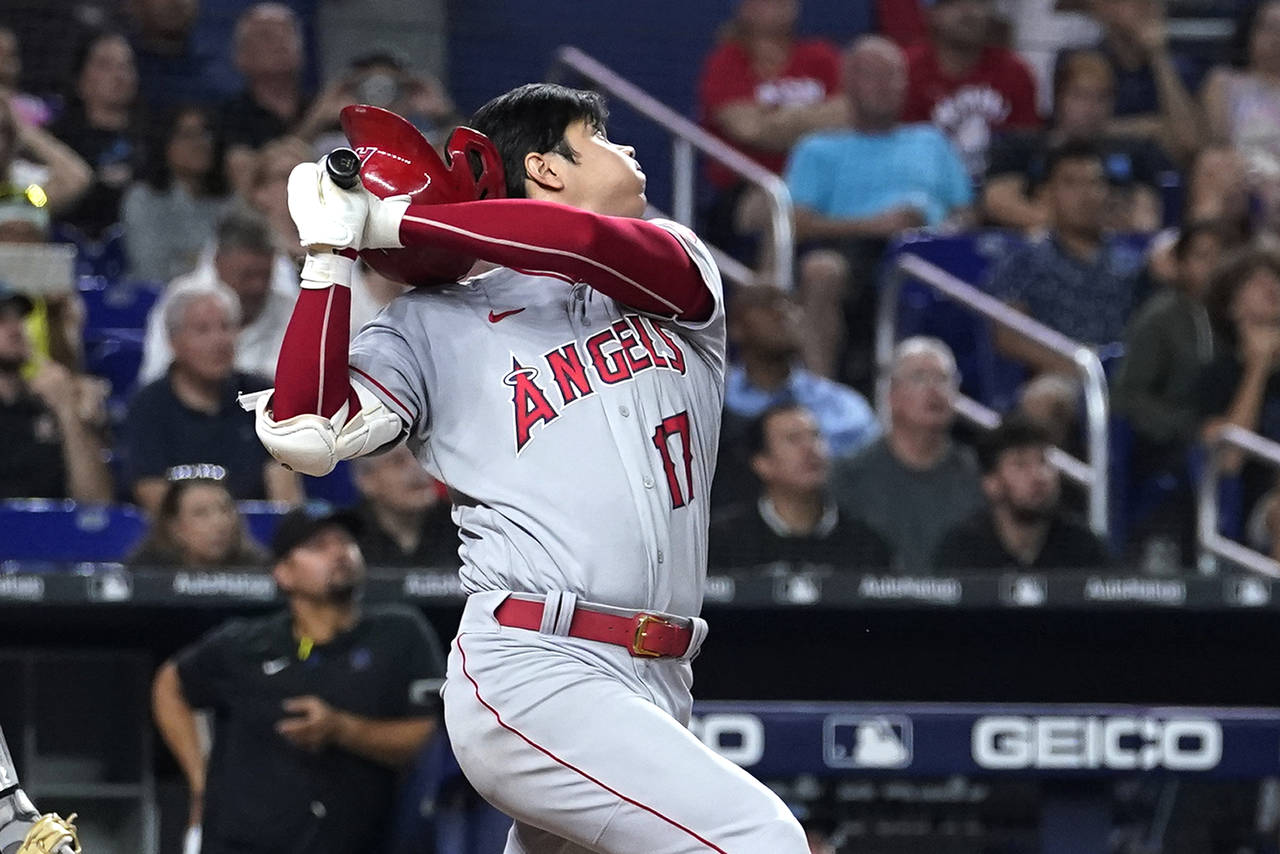 Los Angeles Angels' Shohei Ohtani loses his helmet while batting during the fifth inning of the tea...