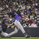 
              Colorado Rockies' Charlie Blackmon flies out during the third inning of the team's baseball game against the Milwaukee Brewers on Saturday, July 23, 2022, in Milwaukee. (AP Photo/Kenny Yoo)
            