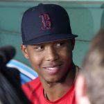 
              Boston Red Sox top pitching prospect Brayan Bello smiles as he speaks to the media in the dugout before a baseball game against the Tampa Bay Rays at Fenway Park, Tuesday, July 5, 2022, in Boston. Bello is scheduled to make his Major League debut on Wednesday. (AP Photo/Mary Schwalm)
            