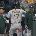 
              Oakland Athletics' Elvis Andrus is greeted at the dugout after he hit a solo home run during the seventh inning of a baseball game, Sunday, July 3, 2022, in Seattle. (AP Photo/Ted S. Warren)
            