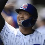 
              Chicago Cubs' Seiya Suzuki celebrates with teammates in the dugout after scoring on a two RBI double hit by Ian Happ during the first inning of a baseball game against the Pittsburgh Pirates Tuesday, July 26, 2022, in Chicago. (AP Photo/Paul Beaty)
            