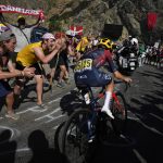 
              FILE - Britain's Thomas Pidcock climbs Alpe D'Huez during the twelfth stage of the Tour de France cycling race over 165.5 kilometers (102.8 miles) with start in Briancon and finish in Alpe d'Huez, France, Thursday, July 14, 2022. (AP Photo/Daniel Cole, File)
            