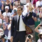 
              Switzerland's Roger Federer waves during a 100 years of Centre Court celebration on day seven of the Wimbledon tennis championships in London, Sunday, July 3, 2022. (AP Photo/Kirsty Wigglesworth)
            