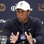 
              US golfer Tiger Woods speaks during a press conference at the British Open golf championship in St Andrews, Scotland, Tuesday, July 12, 2022. The Open Championship returns to the home of golf on July 14-17, 2022, to celebrate the 150th edition of the sport's oldest championship, which dates to 1860 and was first played at St. Andrews in 1873. (AP Photo/Peter Morrison)
            