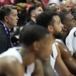 
              Miami Heat assistant Tim Cone, left, watches during the first half an NBA summer league basketball game against the Atlanta Hawks, Tuesday, July 12, 2022, in Las Vegas. (AP Photo/John Locher)
            