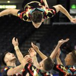 
              Members of the Romanian aerobic gymnastics team compete during The World Games in Birmingham, Ala., on Wednesday, July 13, 2022. (AP Photo/Jay Reeves)
            