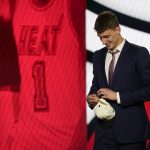 
              Nikola Jovic reacts after being selected 27th overall by the Miami Heat in the NBA basketball draft, Thursday, June 23, 2022, in New York. (AP Photo/John Minchillo)
            