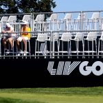 
              Spectators sit in a grandstand on the 17th hole during the second round of the Portland Invitational LIV Golf tournament in North Plains, Ore., Friday, July 1, 2022. (AP Photo/Steve Dipaola)
            