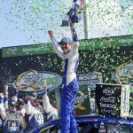 
              Chase Elliott (9) reacts in Victory Lane after winning the NASCAR Cup Series auto race at Atlanta Motor Speedway, Sunday, July 10, 2022, in Hampton, Ga. (AP Photo/John Bazemore)
            