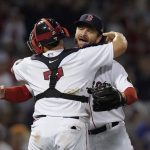 
              Boston Red Sox's Ryan Brasier, right, celebrates with Christian Vazquez (7) after beating the New York Yankees 11-6 in a baseball game, Sunday, July 10, 2022, in Boston. (AP Photo/Steven Senne)
            