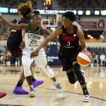 
              Indiana Fever guard Danielle Robinson (3) drives on Seattle Storm guard Jewell Loyd (24) in the second half of a WNBA basketball game in Indianapolis, Tuesday, July 5, 2022. The Storm defeated the Fever 95-73. (AP Photo/Michael Conroy)
            