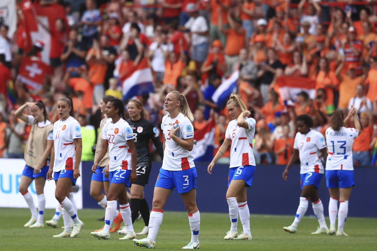 Netherlands' players celebrate after winning the Women Euro 2022 soccer match between Switzerland a...