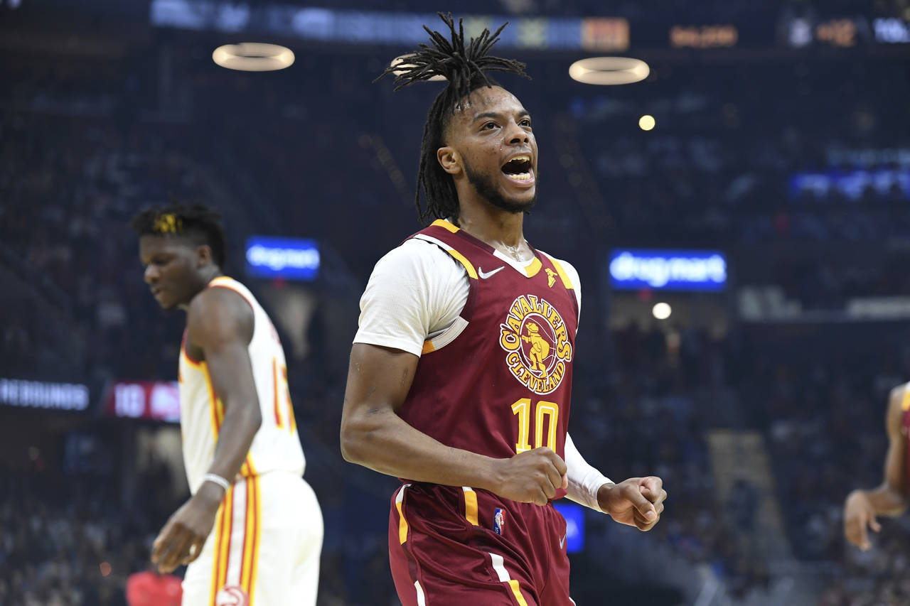 FILE - Cleveland Cavaliers' Darius Garland (10) reacts to a basket during the first half of the tea...