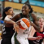 
              Seattle Storm center Tina Charles (31) gets tied up by Indiana Fever forward Emma Cannon (32) in the first half of a WNBA basketball game in Indianapolis, Tuesday, July 5, 2022. (AP Photo/Michael Conroy)
            