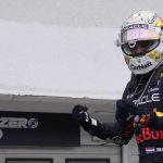 
              Red Bull driver Max Verstappen of the Netherlands celebrates after winning the Hungarian Formula One Grand Prix at the Hungaroring racetrack in Mogyorod, near Budapest, Hungary, Sunday, July 31, 2022. (AP Photo/Darko Bandic)
            
