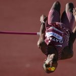 
              Mutaz Essa Barshim, of Qatar, competes during in the men's high jump final at the World Athletics Championships on Monday, July 18, 2022, in Eugene, Ore. (AP Photo/Gregory Bull)
            
