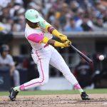 
              San Diego Padres' Esteury Ruiz hits an RBI single against the Arizona Diamondbacks during the second inning of a baseball game Friday, July 15, 2022, in San Diego. (AP Photo/Derrick Tuskan)
            