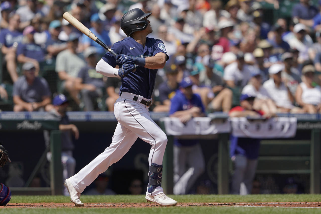 Seattle Mariners' Sam Haggerty hits an RBI-double to score J.P. Crawford during the second inning o...