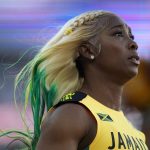 
              Shelly-Ann Fraser-Pryce, of Jamaica, reacts after winning Gold in the final in the women's 100-meter run at the World Athletics Championships on Sunday, July 17, 2022, in Eugene, Ore. (AP Photo/Ashley Landis)
            