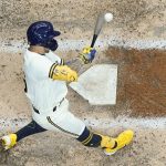 
              Milwaukee Brewers' Kolten Wong hits a single during the fourth inning of a baseball game against the Chicago Cubs Tuesday, July 5, 2022, in Milwaukee. (AP Photo/Morry Gash)
            