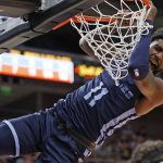 
              Memphis Grizzlies guard Shaq Buchanan reacts after a dunk against the Oklahoma City Thunder during the first half of an NBA summer league basketball game Wednesday, July 6, 2022, in Salt Lake City. (AP Photo/Jeff Swinger)
            