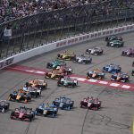 
              Will Power, of Australia (12) leads the field at the start of an IndyCar Series auto race, Saturday, July 23, 2022, at Iowa Speedway in Newton, Iowa. (AP Photo/Charlie Neibergall)
            