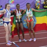 
              Gold medalist Faith Kipyegon, of Kenya, center, stands with silver medalist Gudaf Tsegay, of Ethiopia, left, and bronze medalist Laura Muir, of Britain, after the women's 1500-meter run the at the World Athletics Championships on Monday, July 18, 2022, in Eugene, Ore. (AP Photo/David J. Phillip)
            