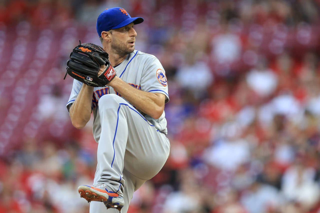 FILE - New York Mets' Max Scherzer throws during a baseball game against the Cincinnati Reds in Cin...