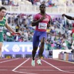 
              Imranur Bracy, of the United States, wins a heat in the men's 100-meter run at the World Athletics Championships Friday, July 15, 2022, in Eugene, Ore. (AP Photo/Ashley Landis)
            