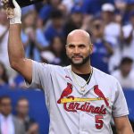 
              St. Louis Cardinals' Albert Pujols acknowledges the crowd prior to his first at-bat against the Toronto Blue Jays in a baseball game Wednesday, July 27, 2022, in Toronto. (Jon Blacker/The Canadian Press via AP)
            