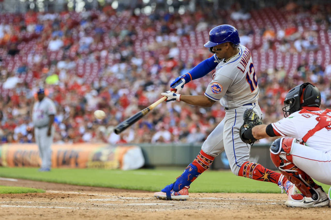 New York Mets' Francisco Lindor hits a solo home run during the fifth inning of a baseball game aga...