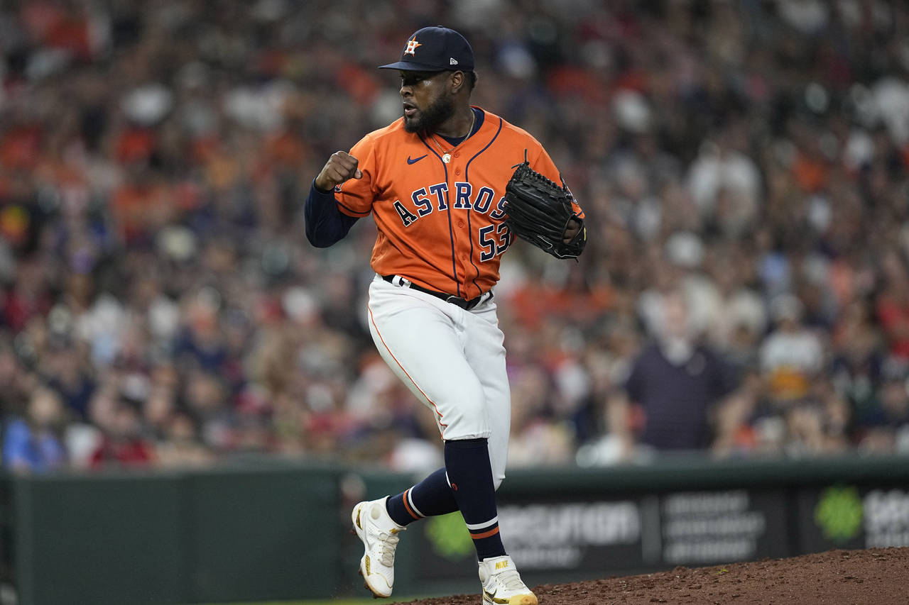 Houston Astros starting pitcher Cristian Javier reacts after striking out Los Angeles Angels' Jared...