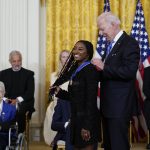 
              President Joe Biden awards the nation's highest civilian honor, the Presidential Medal of Freedom, to gymnast Simone Biles during a ceremony in the East Room of the White House in Washington, Thursday, July 7, 2022. Biles is the most decorated U.S. gymnast in history, winning 32 Olympic and World Championship medals, and is an advocate on issues including athletes' mental health, children in foster care and sexual assault victims. (AP Photo/Susan Walsh)
            