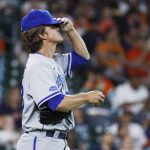 
              Kansas City Royals starting pitcher Zack Greinke reacts after giving up three base hits during the second inning of the team's baseball game against the Houston Astros on Tuesday, July 5, 2022, in Houston. (AP Photo/Kevin M. Cox)
            
