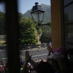 
              Spectators cheer as the pack with Denmark's Jonas Vingegaard, wearing the overall leader's yellow jersey, passes during the eighteenth stage of the Tour de France cycling race over 143.5 kilometers (89.2 miles) with start in Lourdes and finish in Hautacam, France, Thursday, July 21, 2022. (AP Photo/Daniel Cole)
            