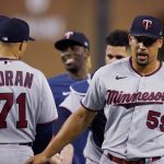 
              Minnesota Twins relief pitcher Jhoan Duran (59) greets teammates after the ninth inning of a baseball game against the Detroit Tigers, Saturday, July 23, 2022, in Detroit. (AP Photo/Carlos Osorio)
            
