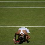 
              Germany's Tatjana Maria reacts after losing a point to Tunisia's Ons Jabeur in a women's singles semifinal match on day eleven of the Wimbledon tennis championships in London, Thursday, July 7, 2022. (AP Photo/Alastair Grant)
            