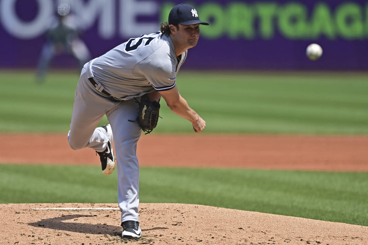 New York Yankees starting pitcher Gerrit Cole delivers in the first baseball game of a doubleheader...